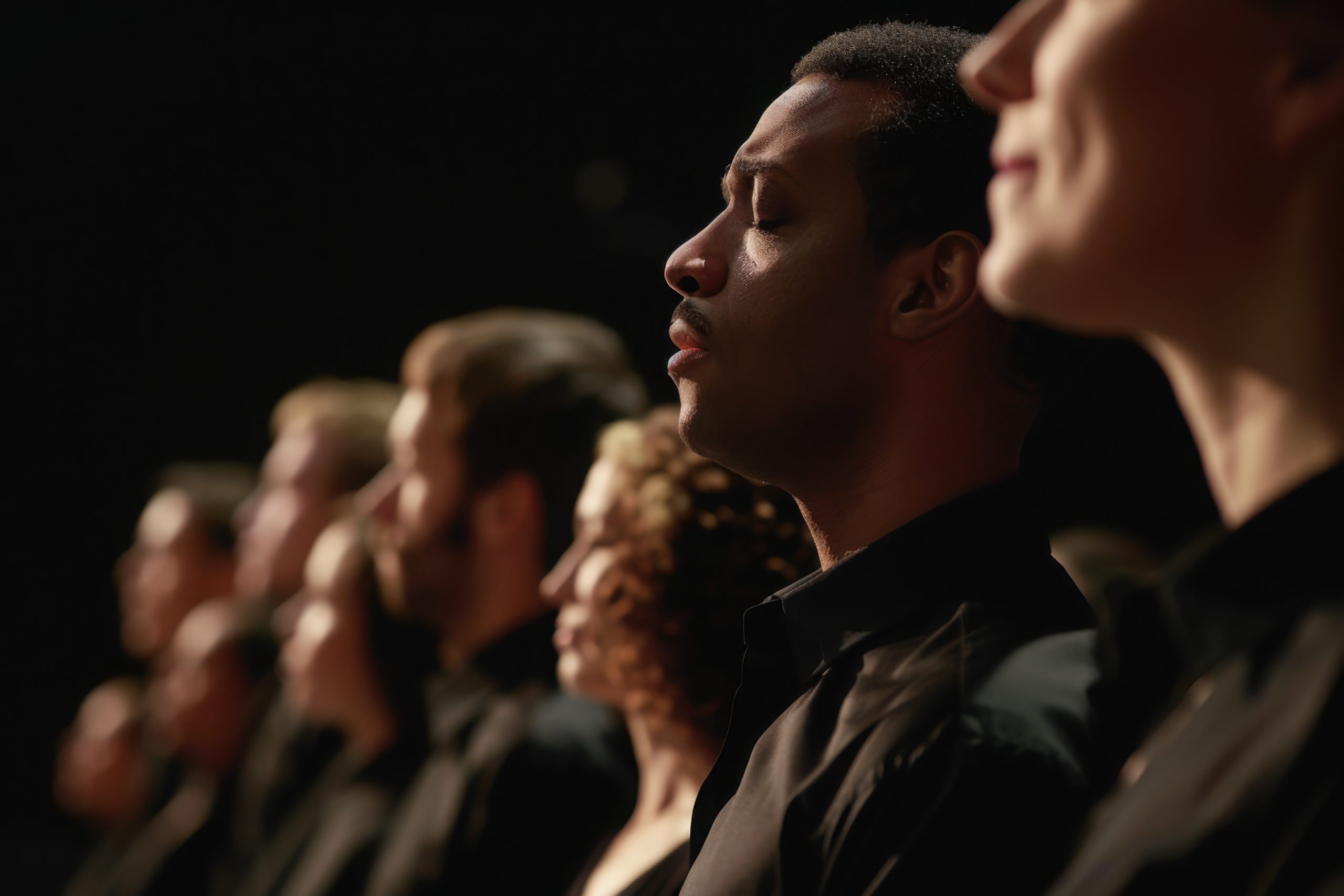 A choir or soloist performing the national anthem, evoking feelings of patriotism